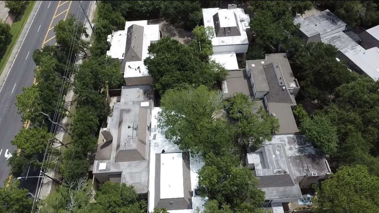 Aerial view of completed TPO flat roofs on modern homes