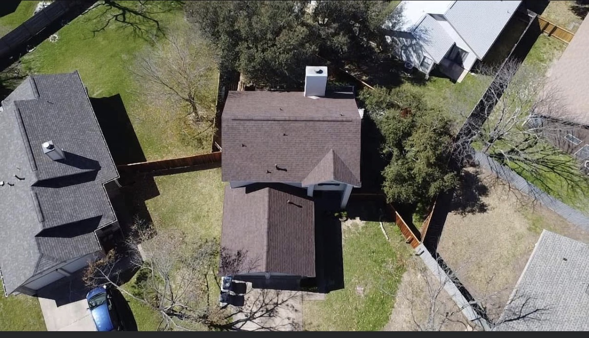 Completed shingle reroof aerial drone view