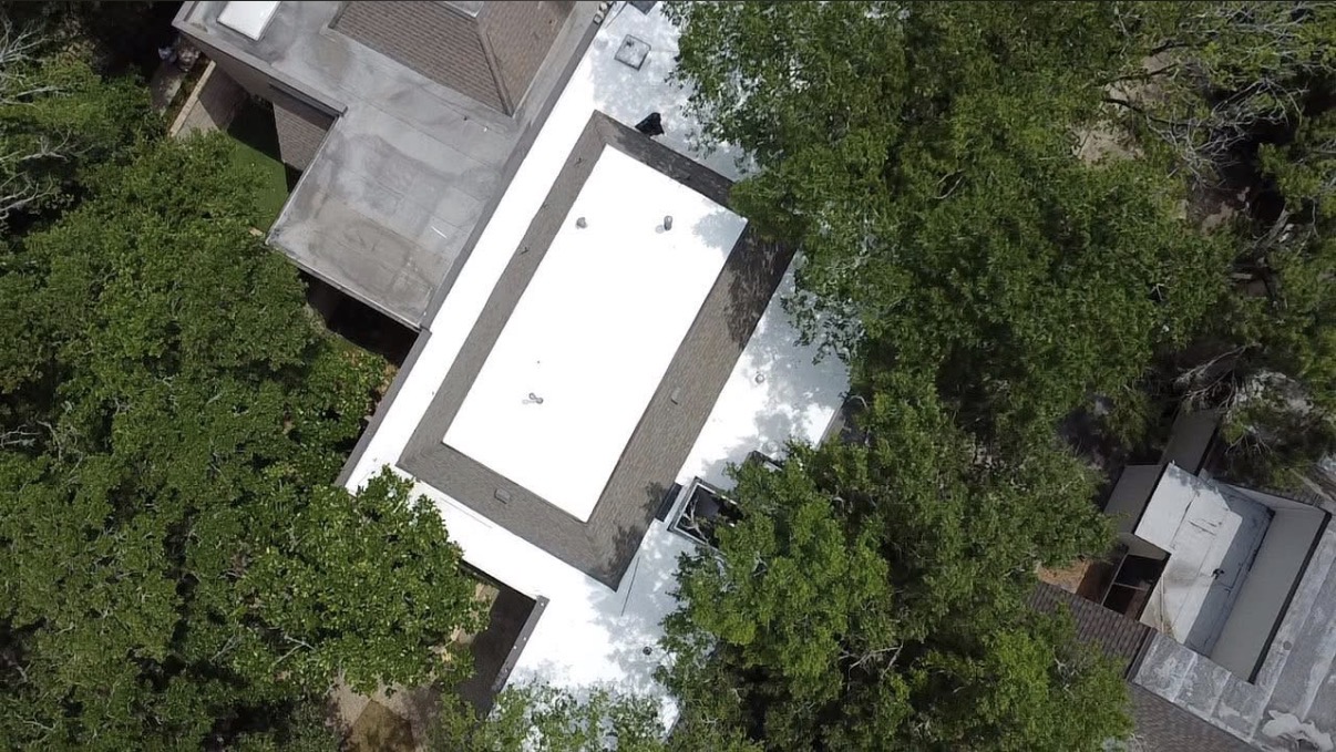 TPO membrane flat roof on modern residence